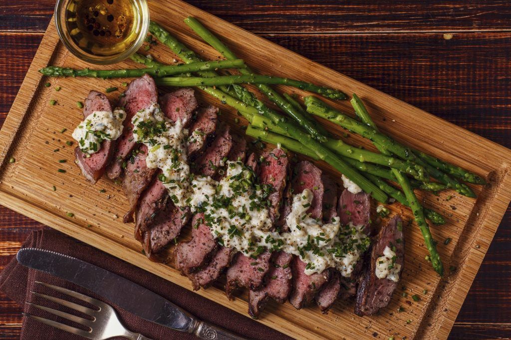 Broiled steak asparagus with feta cream sauce